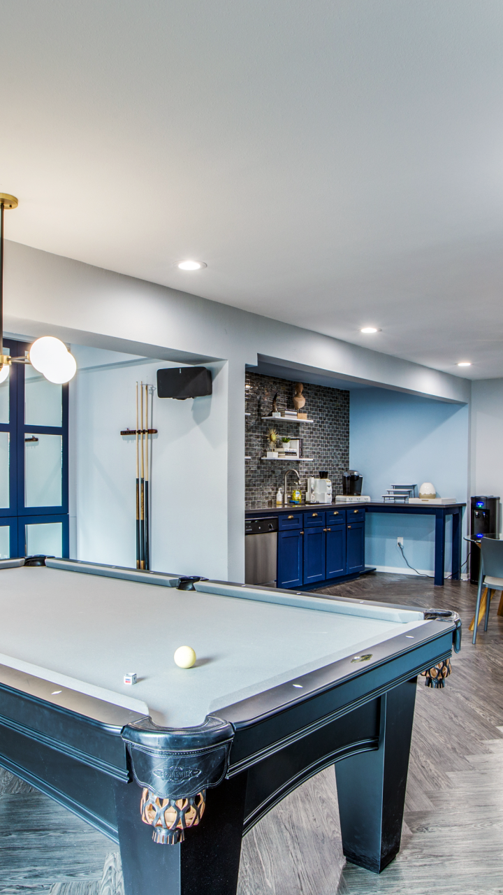 a pool table in a home with blue walls at The WESTON